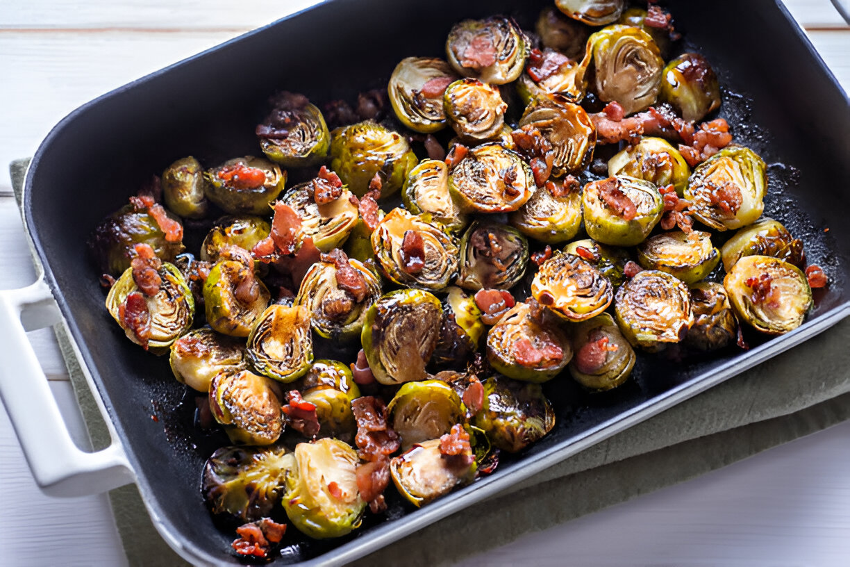 A tray of roasted Brussels sprouts with crispy bacon bits.