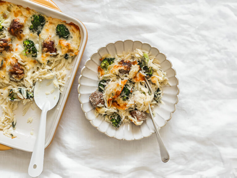 A creamy broccoli chicken casserole served in a white dish and a plate with a fork.